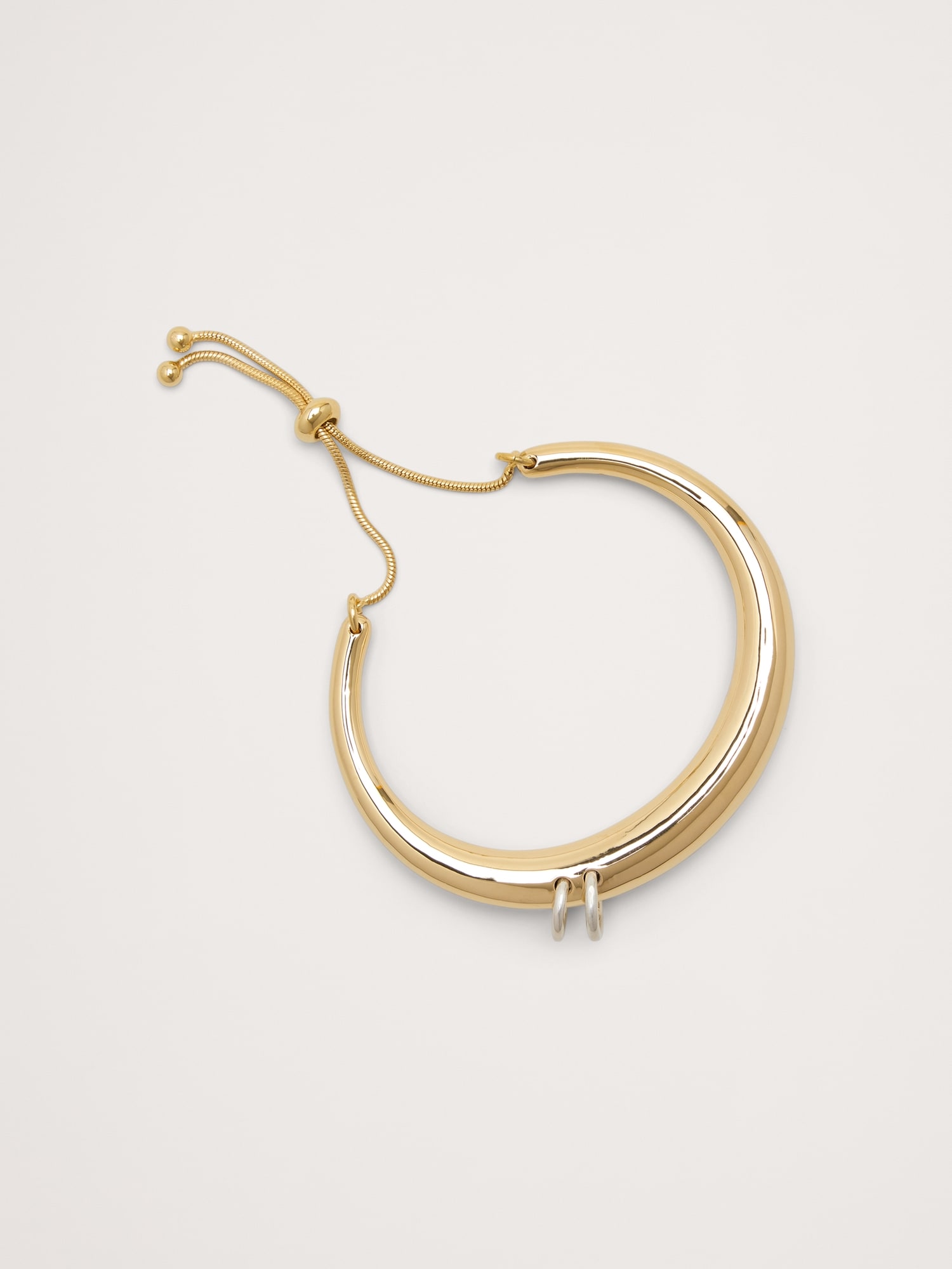 BRACELET-MANCHETTE PERCÉ À FERMOIR COULISSANT