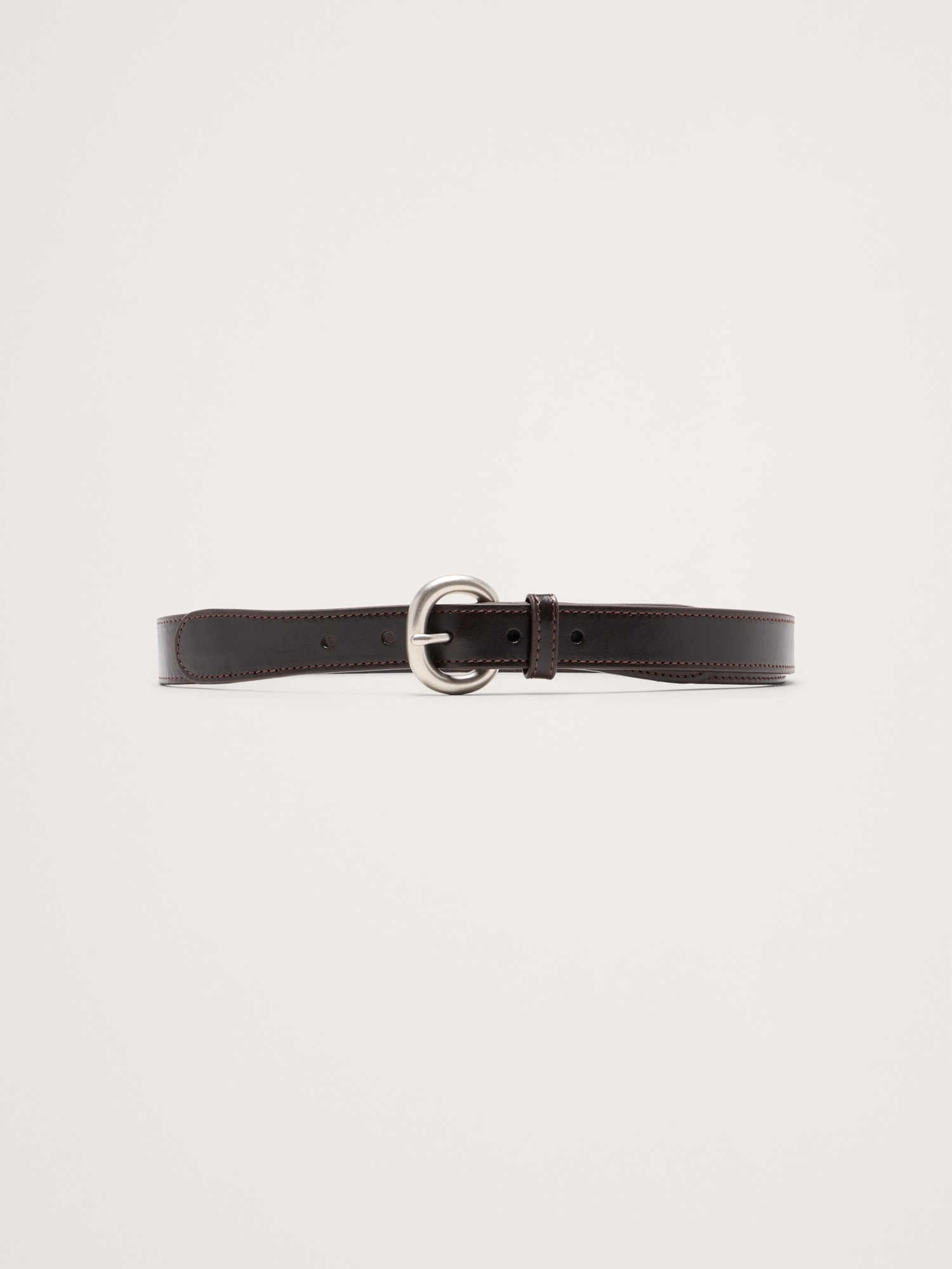 CEINTURE FINE EN CUIR SURPIQUÉ
