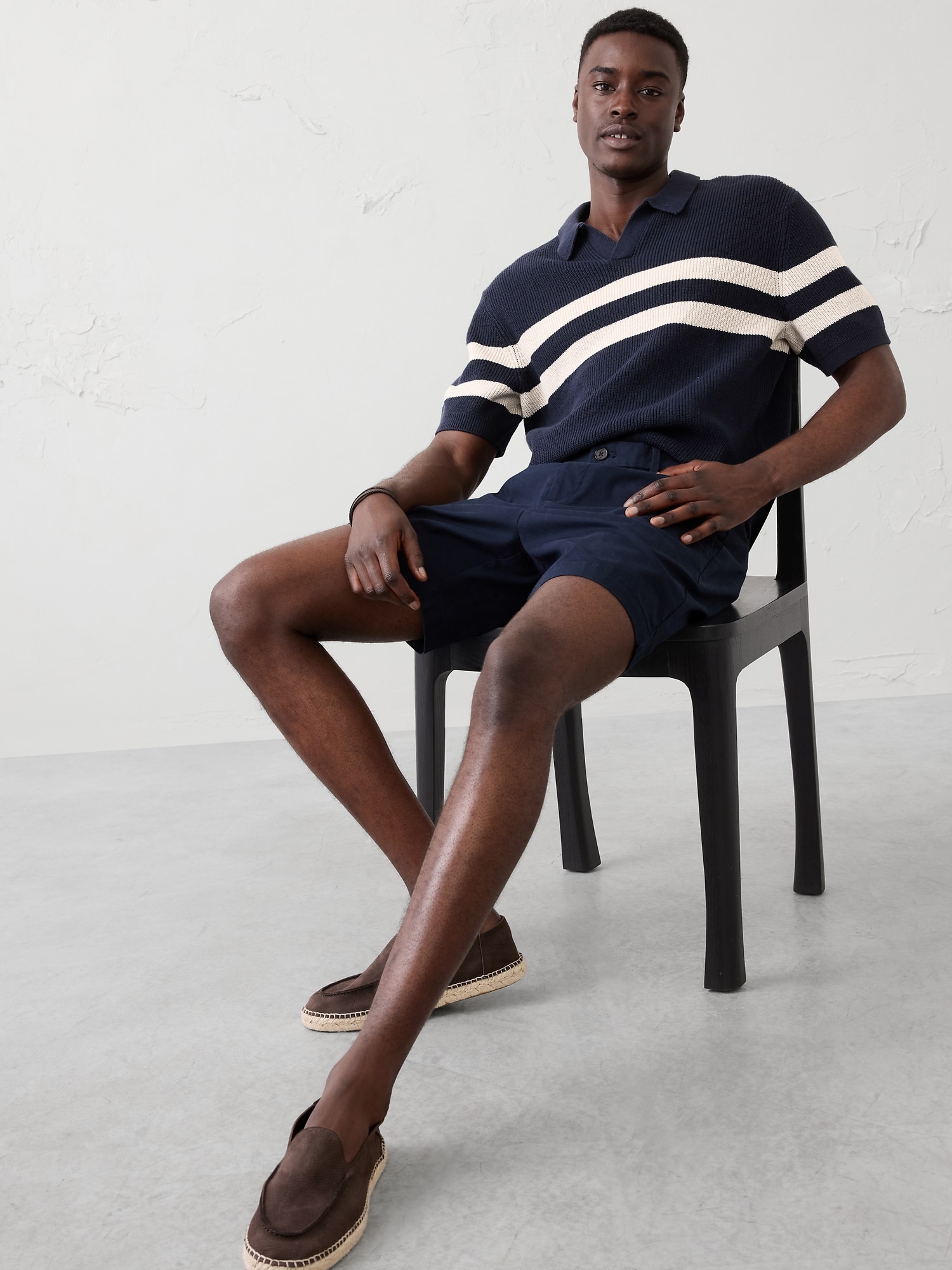 POLO RAYÉ À COL TRICOTEUSE.