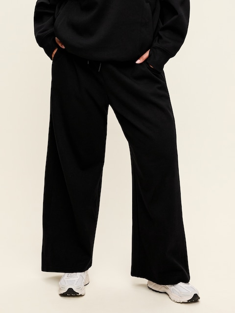 PANTALON EN MOLLETON DYNAMIQUE À TRÈS TAILLE HAUTE ET À JAMBE LARGE